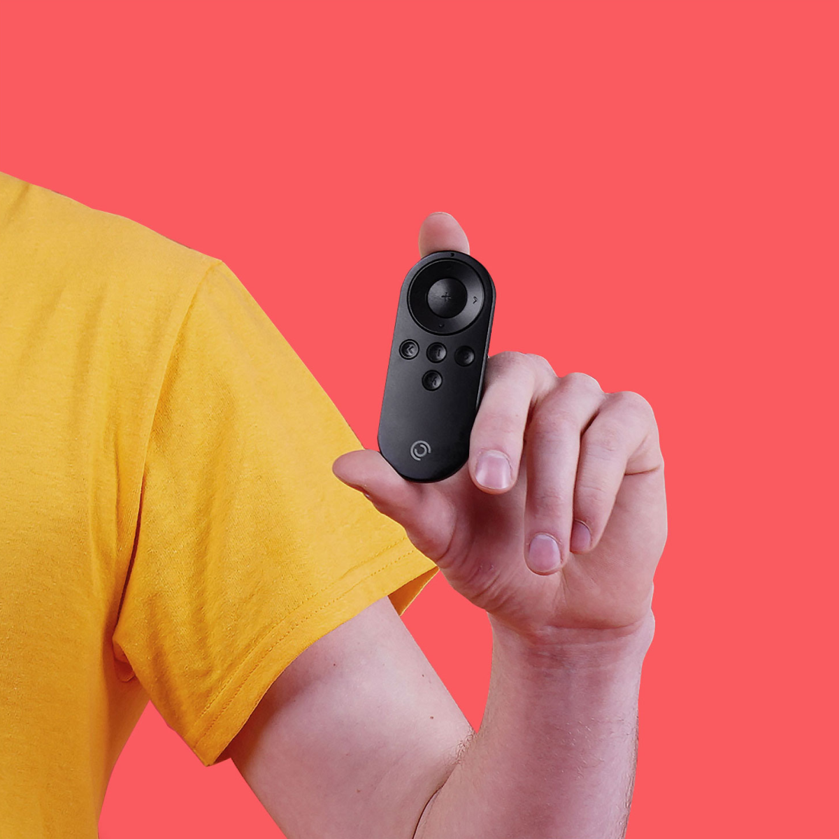 Lightweight black remote control for Pivo Pods & Max held between fingers on red background